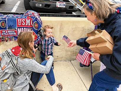 Exchange Distributes Flags at Memorial Day Parade