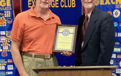 Exchange Presents Book of Golden Deeds to Ben Norris